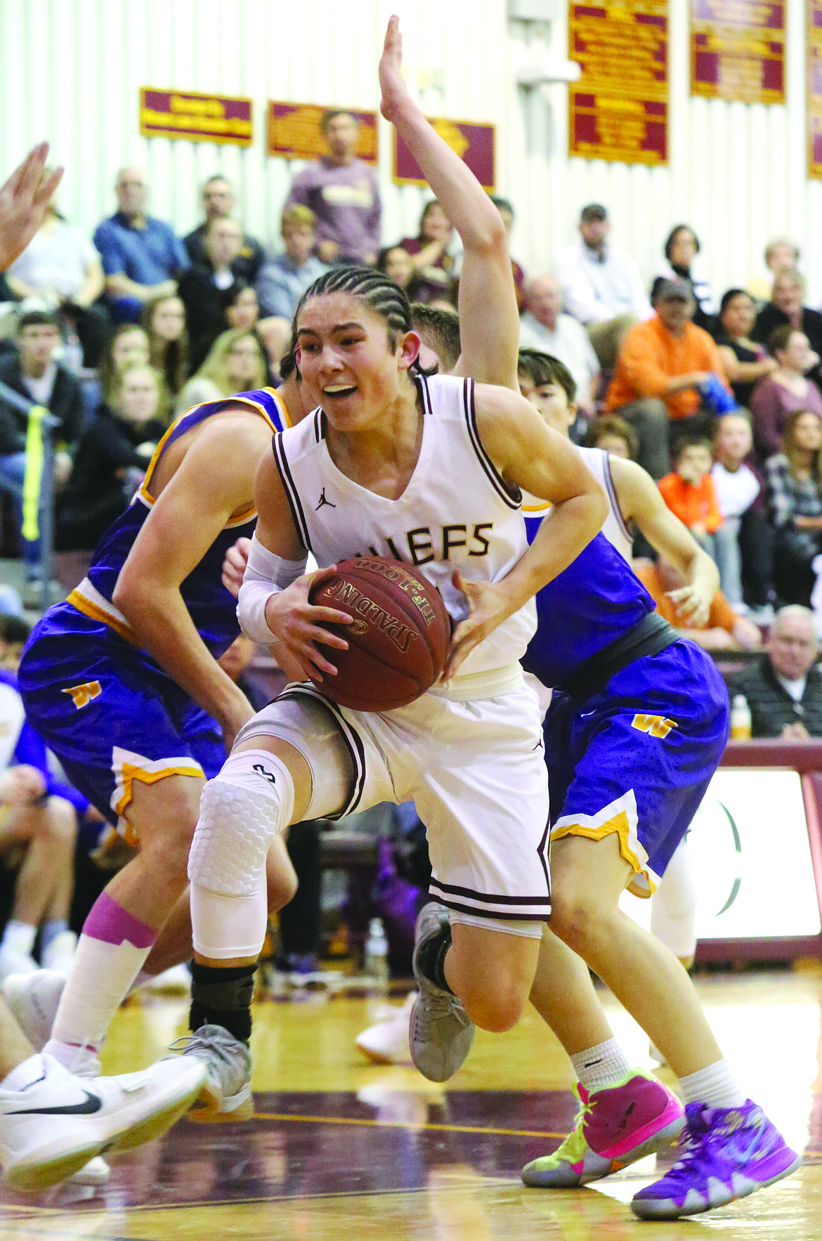 Connor Vanderweyst/Columbia Basin Herald
Moses Lake point guard Cory Kunjara drives to the basket against Wenatchee.