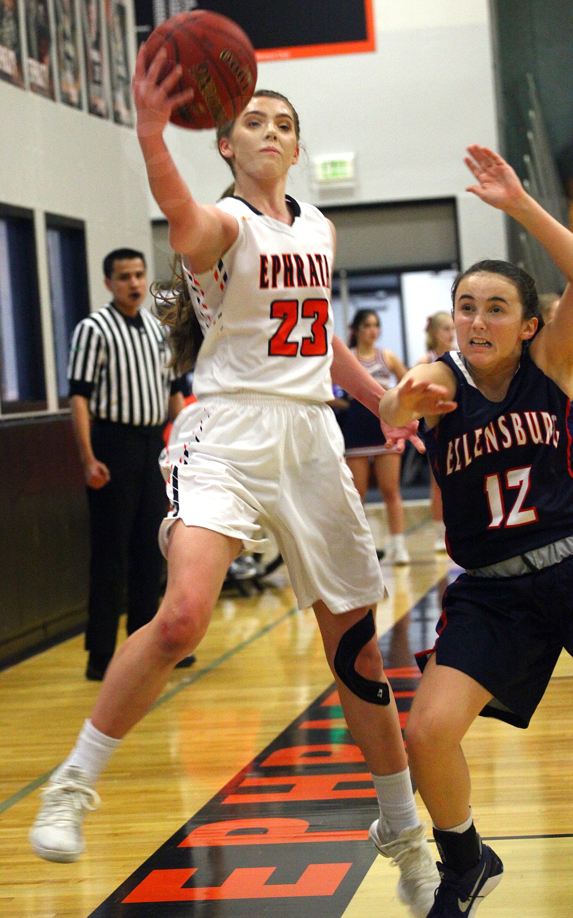Rodney Harwood/Columbia Basin Herald
Ephrata junior Jamie Oxos (24) chases down a loose ball in front of Ellensburg defender Aucklyn Ness (12) to save it back into the court during Tuesday's game in Ephrata.
