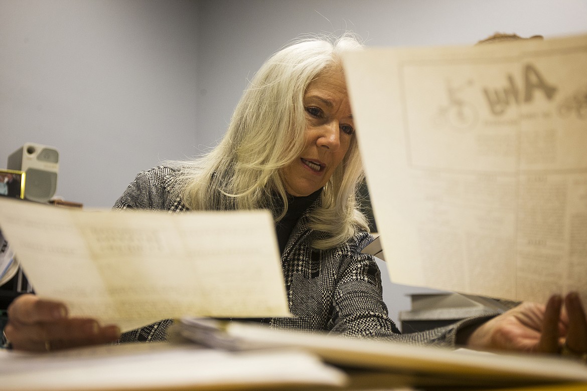 Gail Thompson, co-owner of Commercial Printing, shows the Coeur d'Alene Press prints from the 1970s. (LOREN BENOIT/Press)