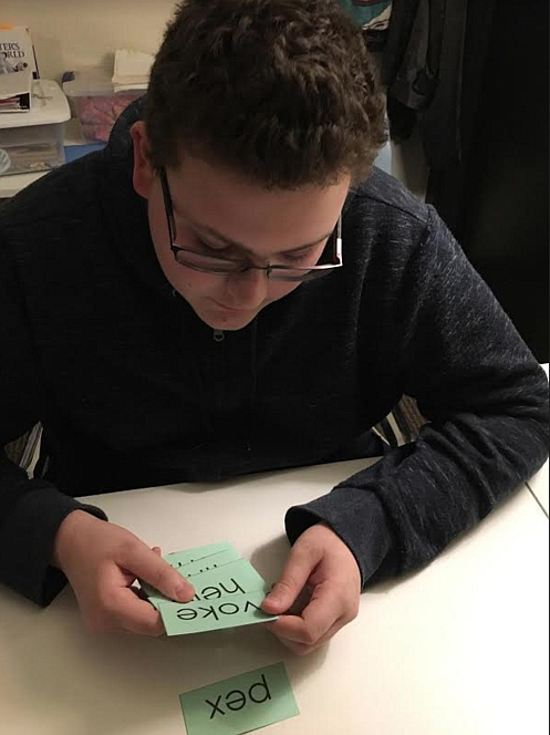 Woodland Middle School eighth-grader Ethan Hime works on a syllable drill to help with his dyslexia during a tutoring session at Wired2Learn NeuroEducation Clinic in Post Falls on Tuesday. Dyslexia is a common reading disorder that can be mild to severe, but it has nothing to do with a person's intellect. (Courtesy photo)