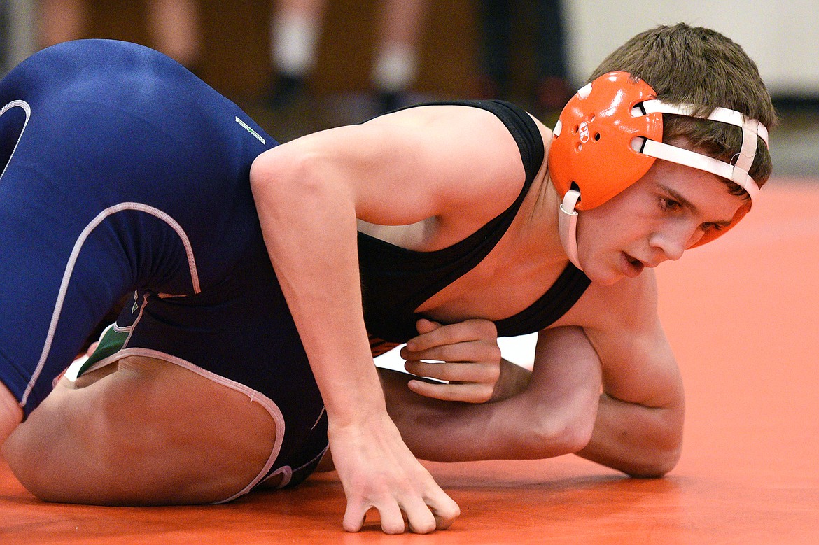 Flathead&#146;s Brendan Barnes works toward a pin of Glacier&#146;s Cody Frost at 103 pounds at the Western AA Divisional seeding tournament at Flathead High School on Saturday. (Casey Kreider/Daily Inter Lake)