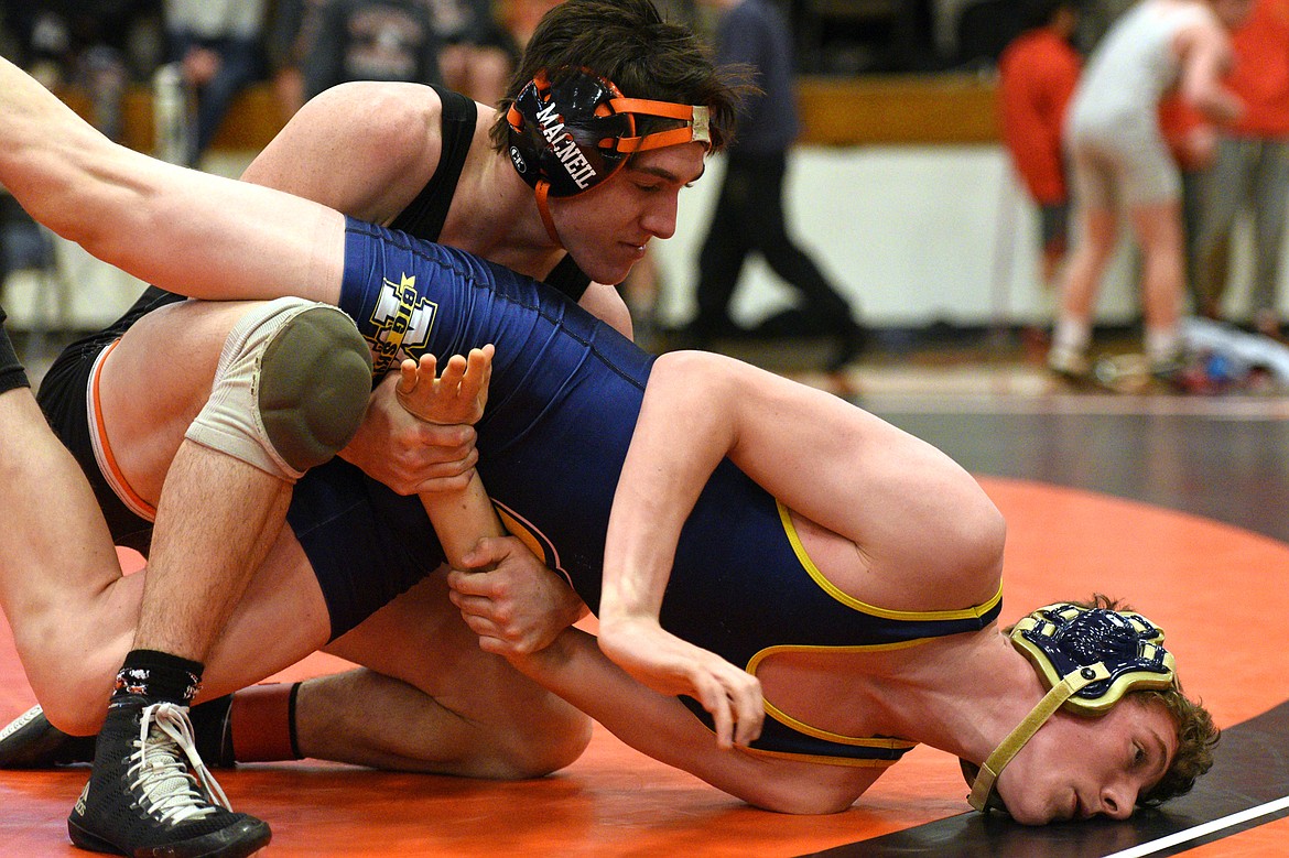 Flathead&#146;s Jaden MacNeil wrestles Missoula Big Sky&#146;s Aaron Toney at 132 pounds at the Western AA Divisional seeding tournament at Flathead High School on Saturday. MacNeil won by pin. (Casey Kreider/Daily Inter Lake)