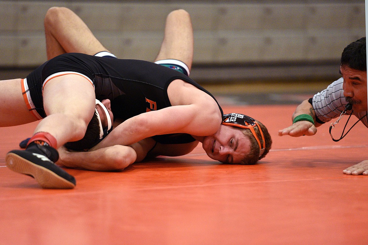 Flathead&#146;s Bo Meyer works toward a pin of Glacier&#146;s Andrew Dixon at 138 pounds at the Western AA Divisional seeding tournament at Flathead High School on Saturday. (Casey Kreider/Daily Inter Lake)