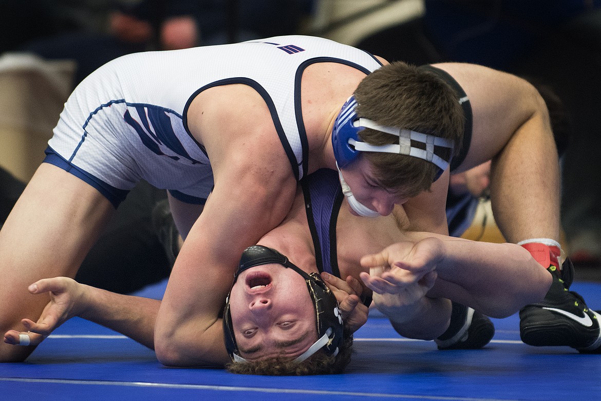 Columbia Falls wrestler Ben Windauer pins Polson&#146;s Hunter Fritsch for the 170-pound Class A Divisional title in Columbia Falls Saturday. (Jeremy Weber photo)