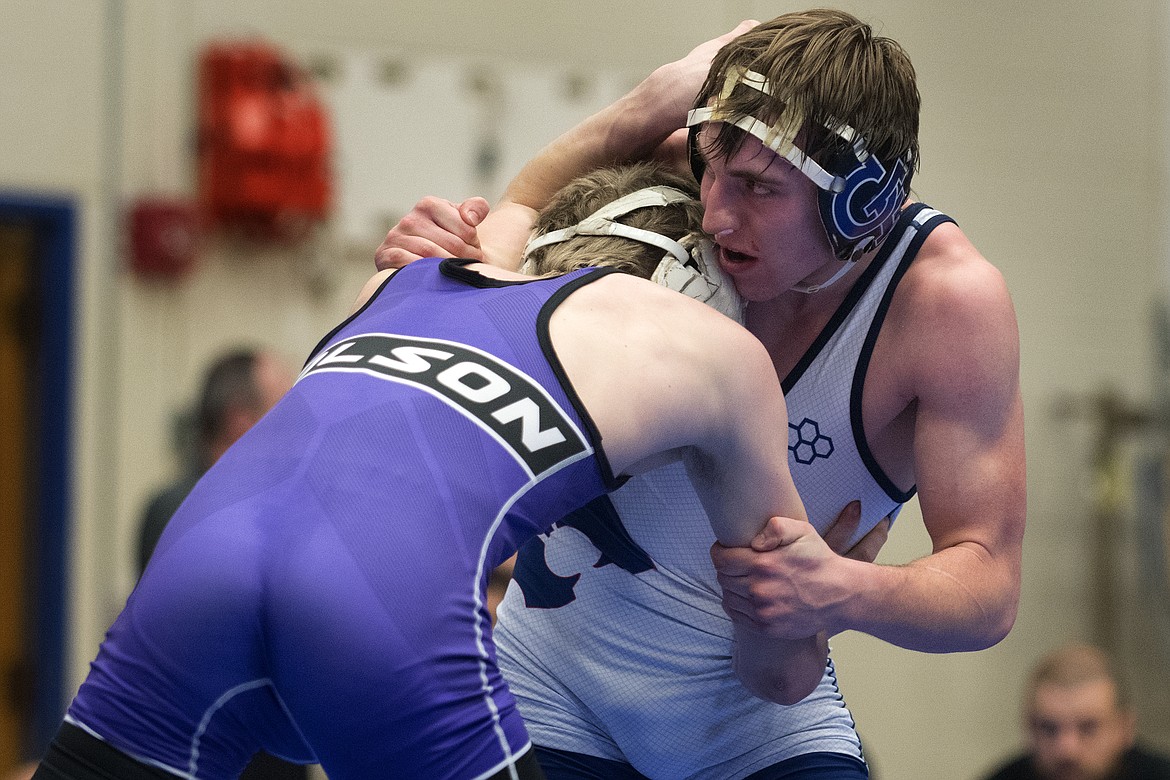 Columbia Falls wrestler Brandon Thomas takes on Polson&#146;s Bridger Wenzel for the 132-pound title at the Class A Divisional Meet in Columbia Falls Saturday. (Jeremy Weber photo)