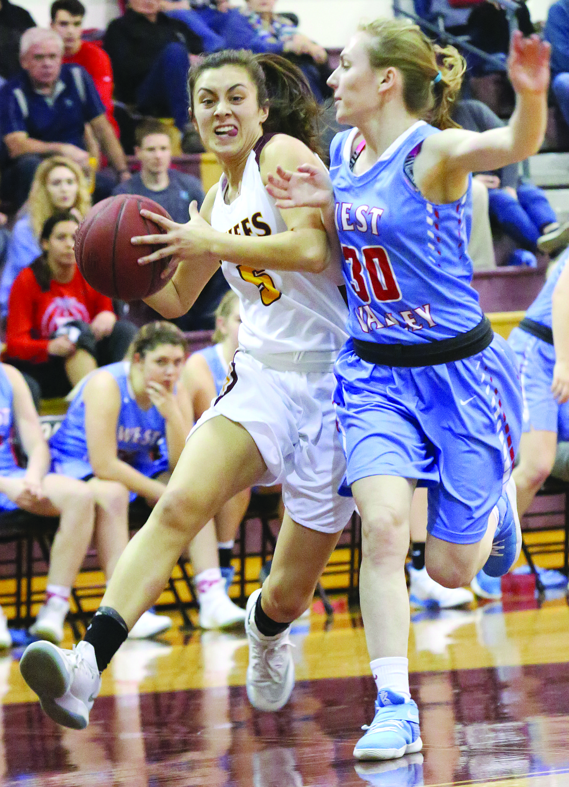 Connor Vanderweyst/Columbia Basin Herald
Moses Lake point guard drives past a West Valley defender Friday.