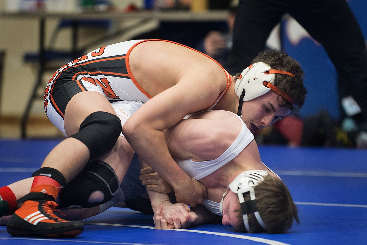 Ronan&#146;s Hunter Peterson battles Frenchtown&#146;s Riley Gun for the 138-pound title at the Class A Divisional Meet in Columbia Falls Saturday. (Jeremy Weber photo)