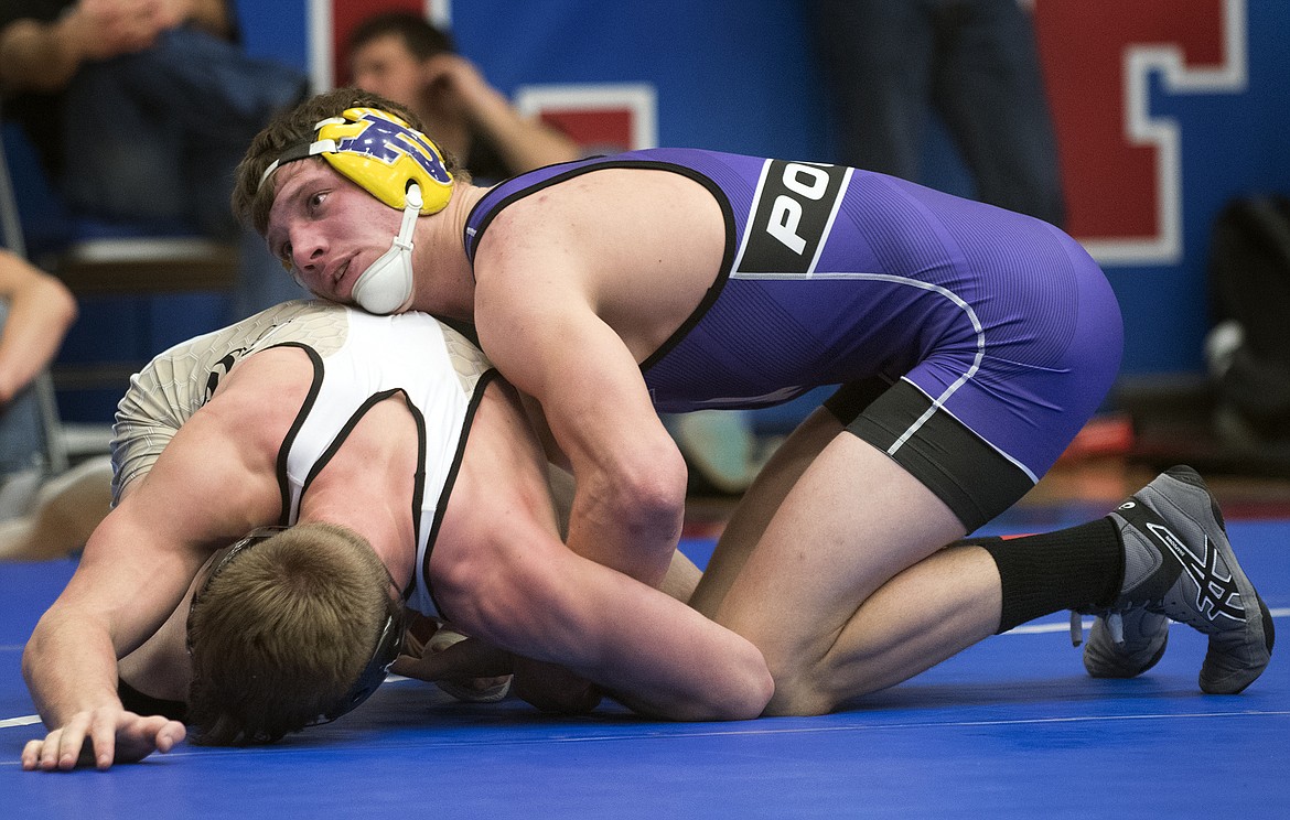 Polson&#146;s Cameron Brown takes on Stevensville/Victor&#146;s Kyler Pancake to earn the 145-pound title at the Class A Divisional Meet in Columbia Falls Saturday. (Jeremy Weber photo)