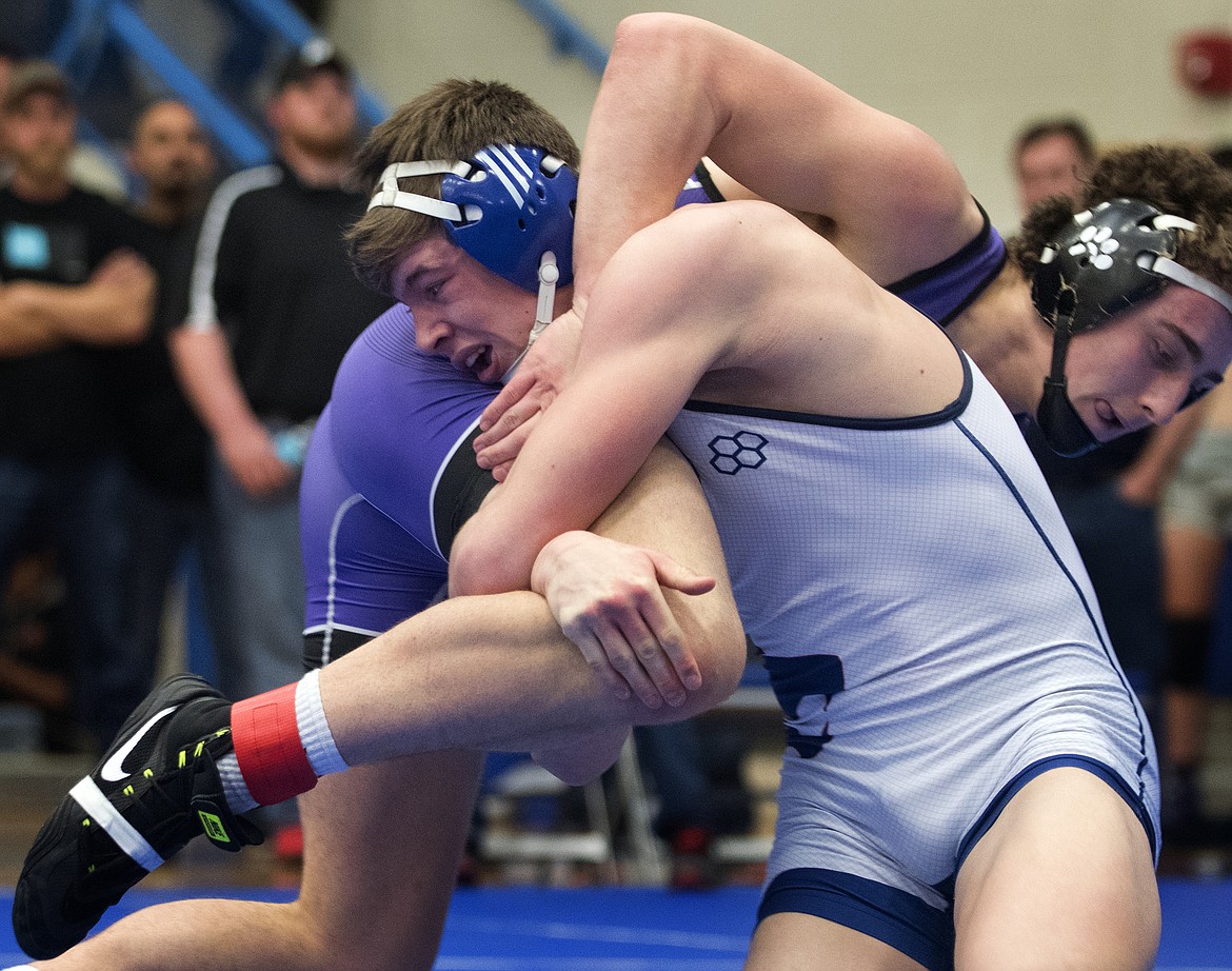 Columbia Falls wrestler Ben Windauer battles Polson&#146;s Hunter Fritsch for the 170-pound Class A Western divisional title in Columbia Falls on Saturday. Windauer won by pin in 2 minutes, 46 seconds. (Jeremy Weber/Hungry Horse News)