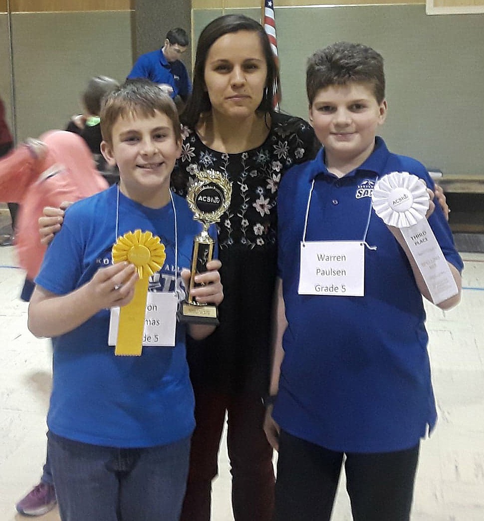 Pictured from left to right are Aaron Thomas, fifth grade teacher Alanah True and Warren Paulsen at the district spelling bee awards ceremony at Kootenai Valley Christian School on Friday, Feb. 2. (Courtesy photo)