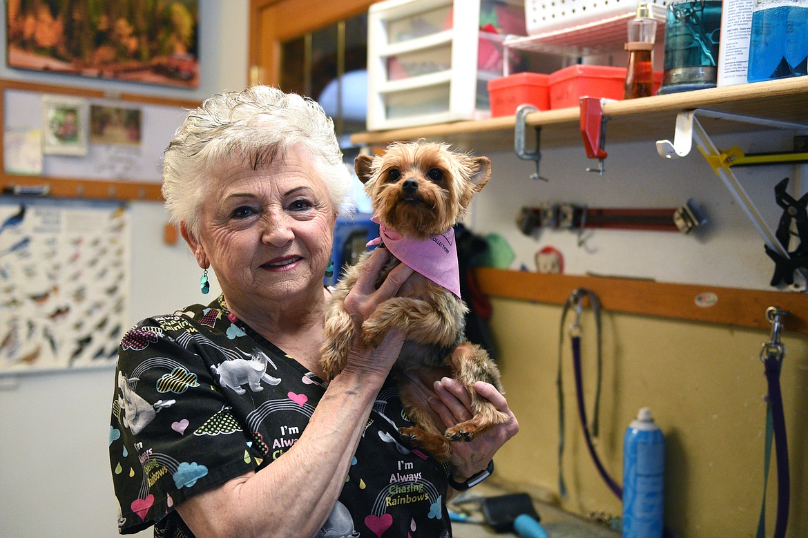 Judy Johnson, owner of Judy's All Breed Dog Grooming, holds Stella, a client's dog, after a grooming session at her shop in Martin City on Wednesday, Jan. 24. (Casey Kreider/Daily Inter Lake)