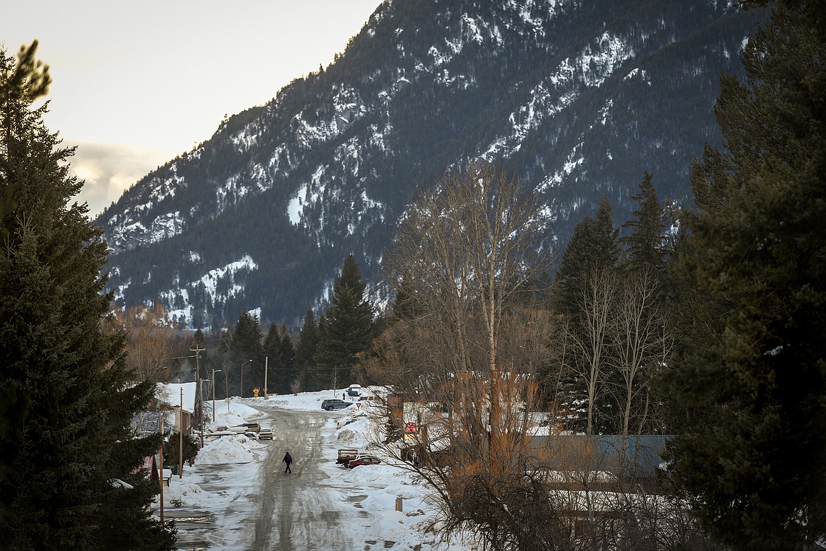 A man walks along Central Avenue in Martin City on Friday, Jan. 19. (Casey Kreider/Daily Inter Lake)