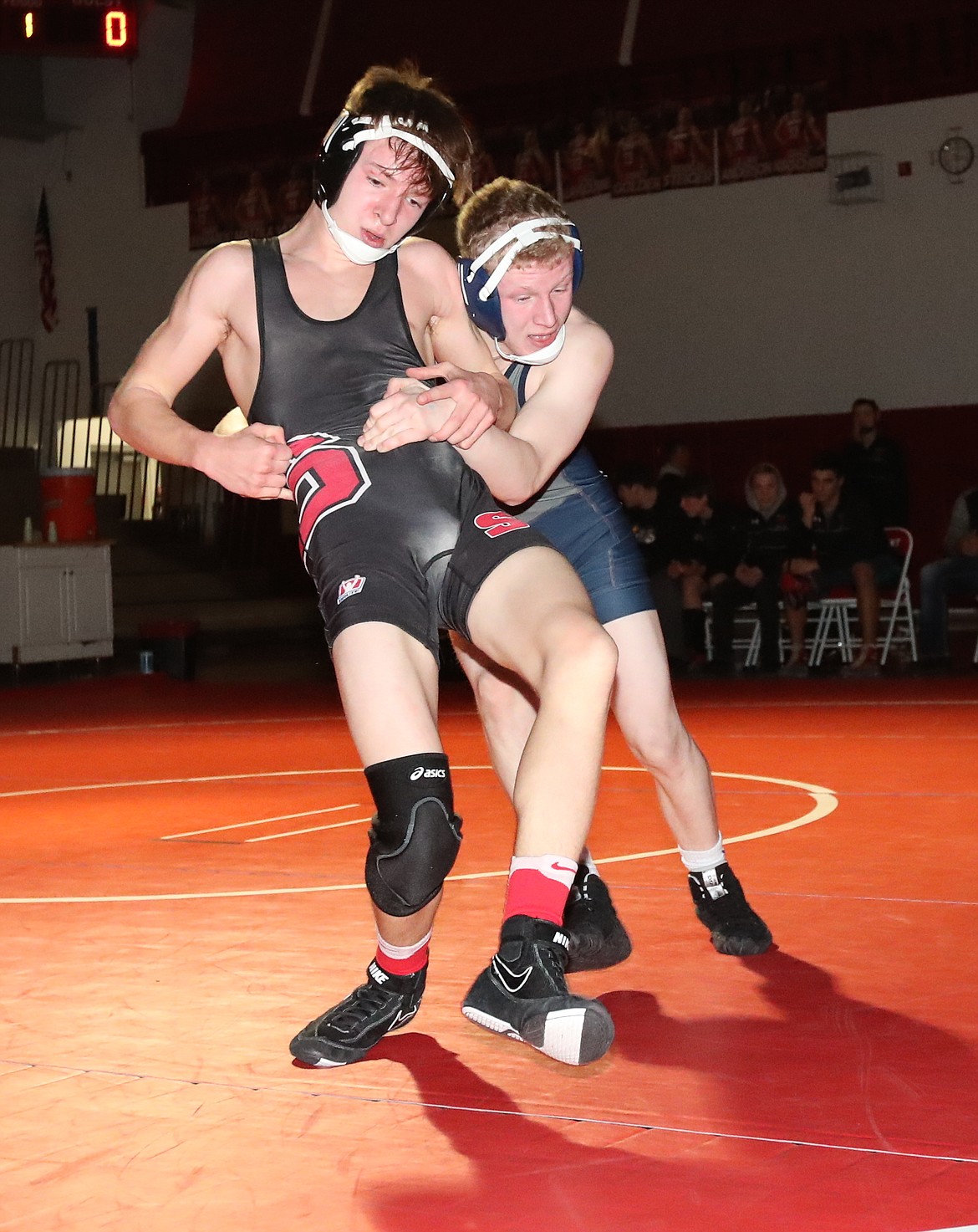 (Photo by ERIC PLUMMER)
Freshman McLean Weig, left, scored an escape in the last few seconds of the match to score a 2-1 win over Devin Sorrelle of Lake City.