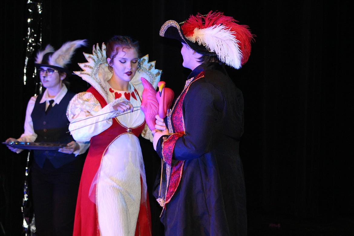 Cheryl Schweizer/Columbia Basin Herald
The Queen of Hearts (Rachel Law) gets ready to play through during the croquet game in the Moses Lake High School production of &#145;Alice in Wonderland,&#146; opening Wednesday. The knave of hearts (Chris Marroquin) may lose his head.