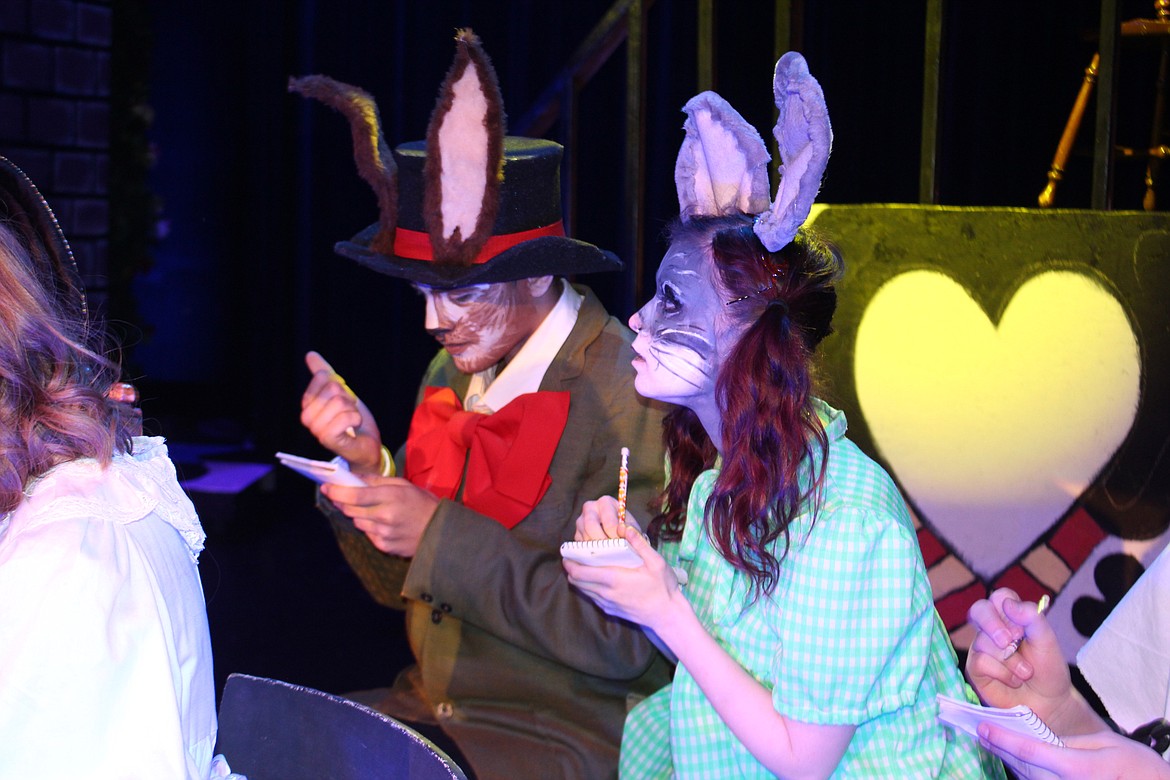 Cheryl Schweizer/Columbia Basin Herald
The March Hare (Lawrence Thompson, left) an the Dormouse (Amanda Miller) listen attentively during the trial of the Knave of Hearts. The Moses Lake High School production of &#145;Alice in Wonderland&#146; opens Wednesday.