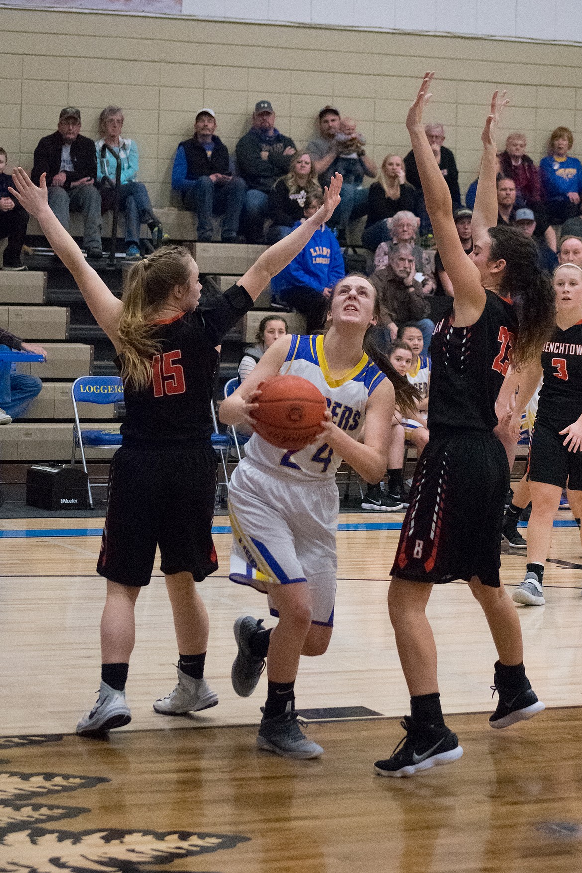WIth 1:30 left in the game, Libby&#146;s Jayden Winslow rolled right around Frenchtown&#146;s Callie Bagnell and dodged Syd Channer to score the only Lady Logger field goal of the second half. (Ben Kibbey/The Western News)