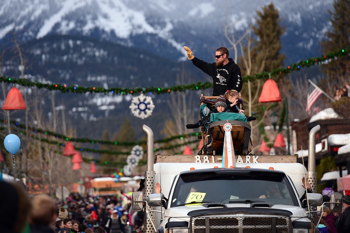 Floats make their way down Central Avenue during the Whitefish Winter Carnival Grand Parade on Saturday. (Casey Kreider/Daily Inter Lake)