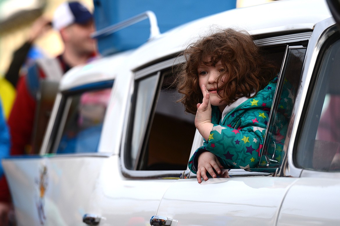 A child waves during the parade.