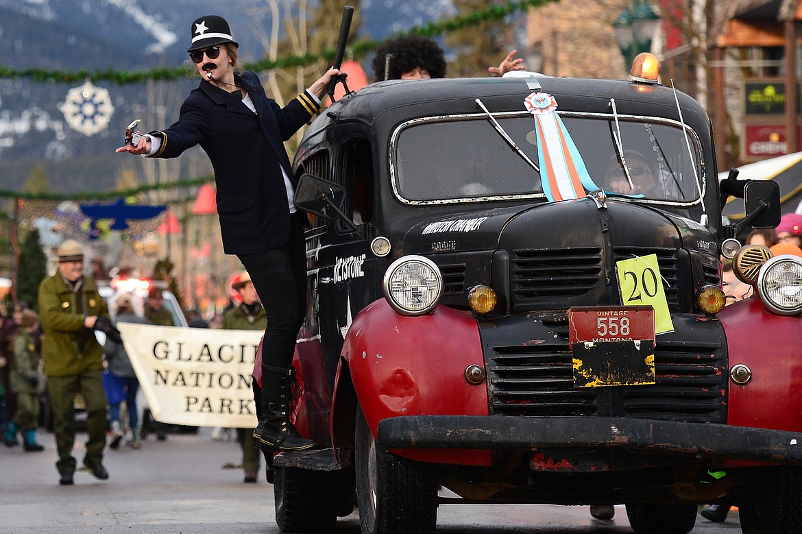 The Keystone Kops toss candy to specators along Central Avenue.