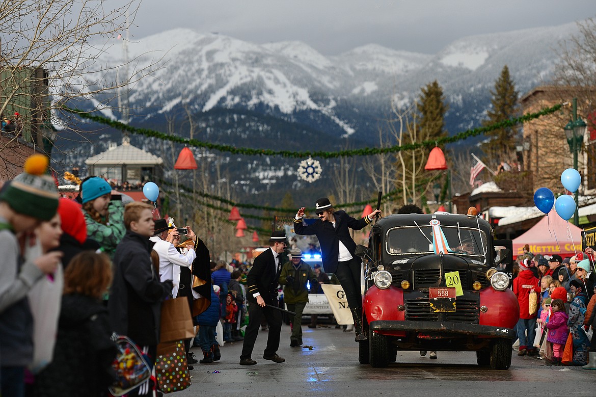 Floats make their way down Central Avenue during the Whitefish Winter Carnival Grand Parade on Saturday. (Casey Kreider/Daily Inter Lake)