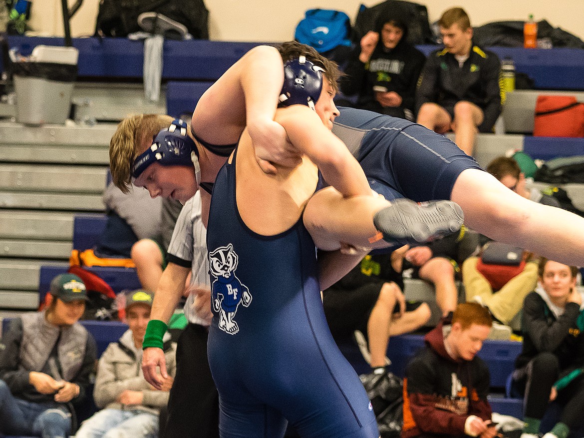 Courtesy photo
Bonners Ferry&#146;s Shane Walker lifts Lake City&#146;s Logan Parson prior to pinning him in a consolation semifinal match at the Bonners Ferry Invitational on Saturday.