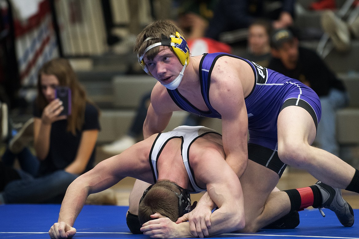 Polson&#146;s Cameron Brown takes on Stevensville/Victor&#146;s Kyler Pancake to earn the 145-pound title at the Class A Divisional Meet in Columbia Falls Saturday. (Jeremy Weber photo)