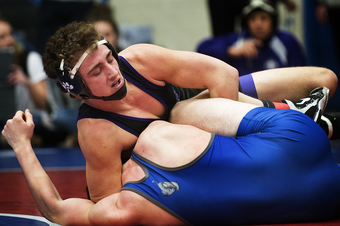 Polson&#146;s Hunter Fritsch takes down Libby/Troy&#146;s Tanner Wood at the Class A Divisional Wrestling Meet in Columbia Falls Friday. (Jeremy Weber/Hungry Horse News)