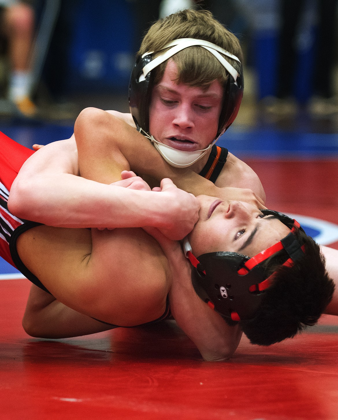 Ronan's Trapper McAllister battles with Browning's Ashton Flamand at the Class A Divisional Wrestling Meet in Columbia Falls Saturday. (Jeremy Weber photo)