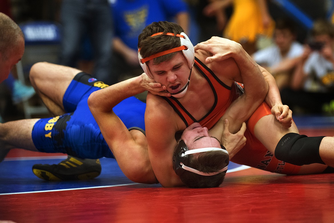 RONAN WRESLTER Hunter Peterson battles Libby/Troy&#146;s Jeffery Woffenbecher at the Class A Divisional Wrestling Meet in Columbia Falls Friday. The Chiefs will send several wrestlers to state in their coach Dylan Kramer&#146;s first-ever year as a head coach for Ronan. According to Kramer, they would like to place strong as a team and aren&#146;t content just qualifying for the big stage as they get ready to try to place in the Class A tournament Feb. 9-10 at MetraPark Arena in Billings (Jeremy Weber/Hungry Horse News)