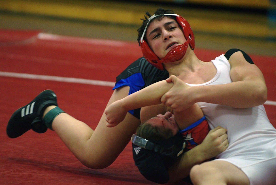 ARLEE WRESTLER Kanoa Palazzolo attempts to pin a wrestler during the Class B-C wrestling Divisional Tournament Saturday at Superior High School. (Jason Blasco/Lake County Leader)