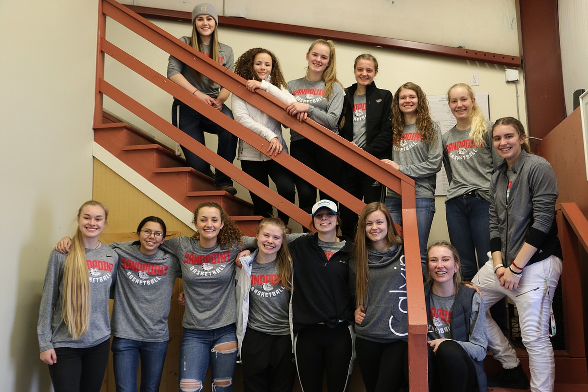 (Photo by MARY MALONE)
The Sandpoint High School girls varsity basketball team gathered at the Bonner Community Food Bank Wednesday to lend a hand. Lilly Anderson, lower left, has been a volunteer at the food bank for two years.