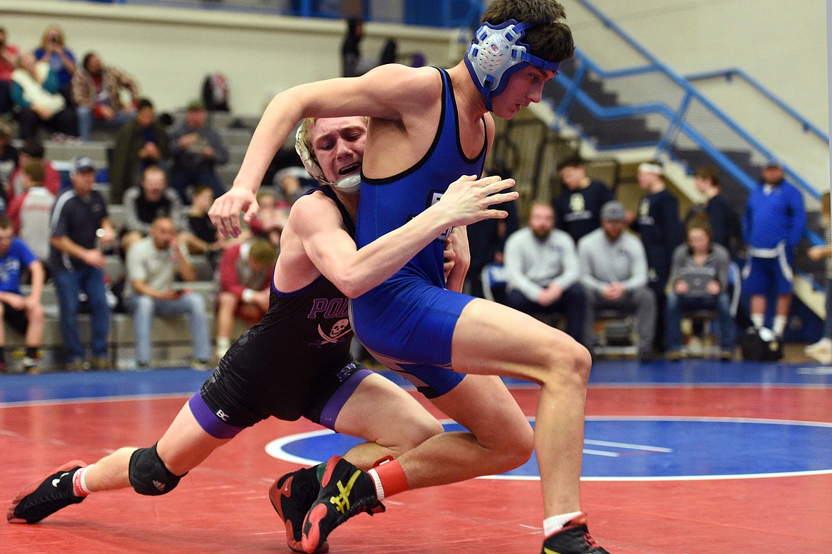 Polson&#146;s Bridger Wenzel wrestles Corvallis&#146; Benji Opat at 132 pounds at the Western A Divisional seeding tournament at Columbia Falls High School on Friday. (Casey Kreider/Daily Inter Lake)