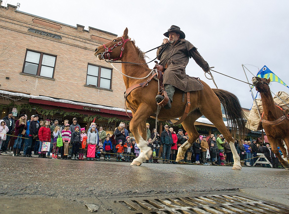 Chuck Allen wrangles his pack string through the Whitefish Winter Carnival last week.