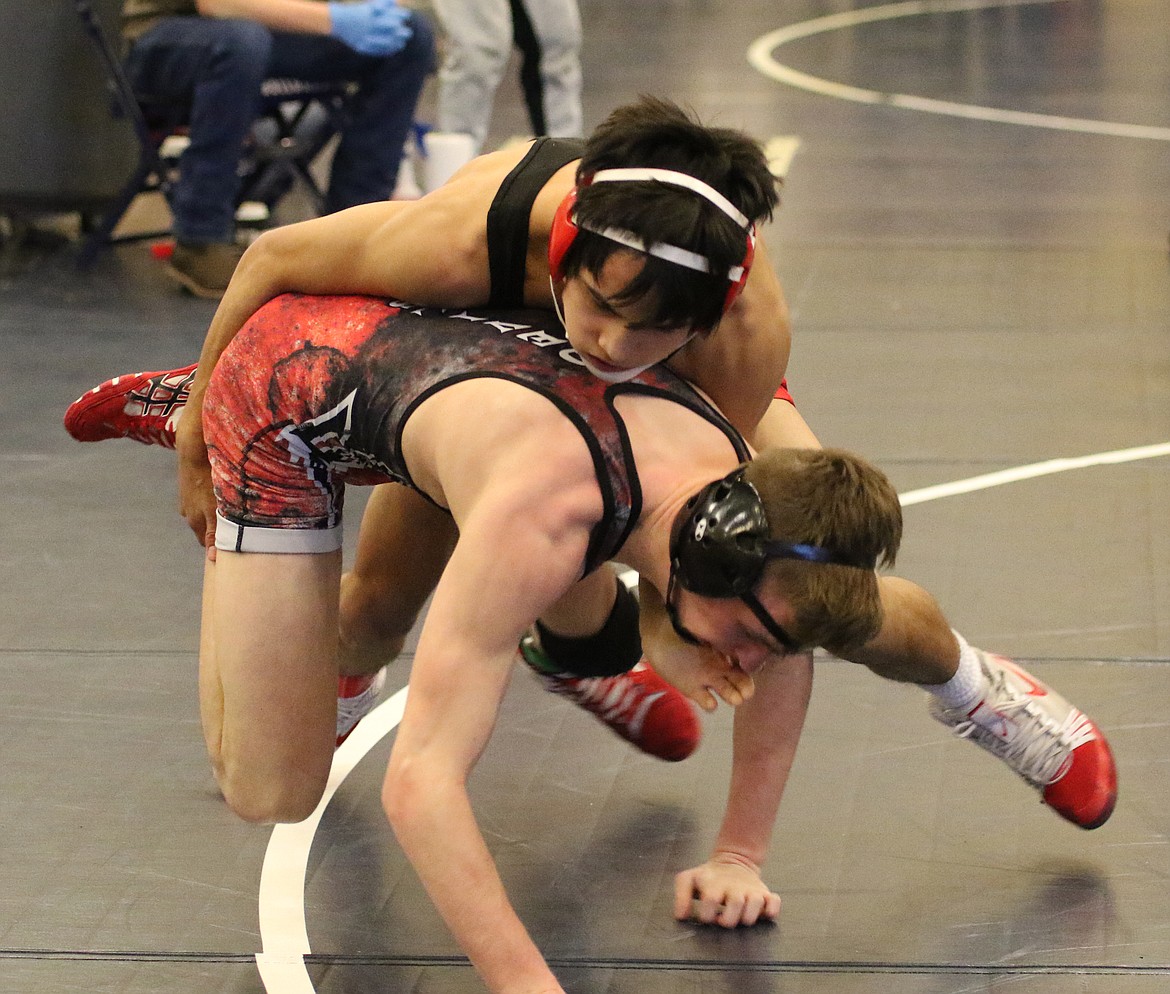 Bob Kirkpatrick/The Sun Tribune - Jaxon Rocha takes down East Valley&#146;s Stephen Nugent is semifinal action. Rocha lost a 10-3 decision, but finished strong, placing fifth with a 5-4 decision over David Saunders from Grandview.