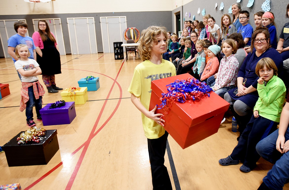 Austin Counts, a third-grader at West Glacier Elementary, was the first student chosen to take part in the interactive presentation by Maddie Murray, Miss Montana 2017, at a school program on Tuesday. Presented with a large box, Counts was given no clue to what was inside it. He was then instructed to either keep the gift for himself or give it away. Counts walked over to his classmates and gave his box to a friend, which was a part of Murray&#146;s presentation on the importance of sharing gifts.