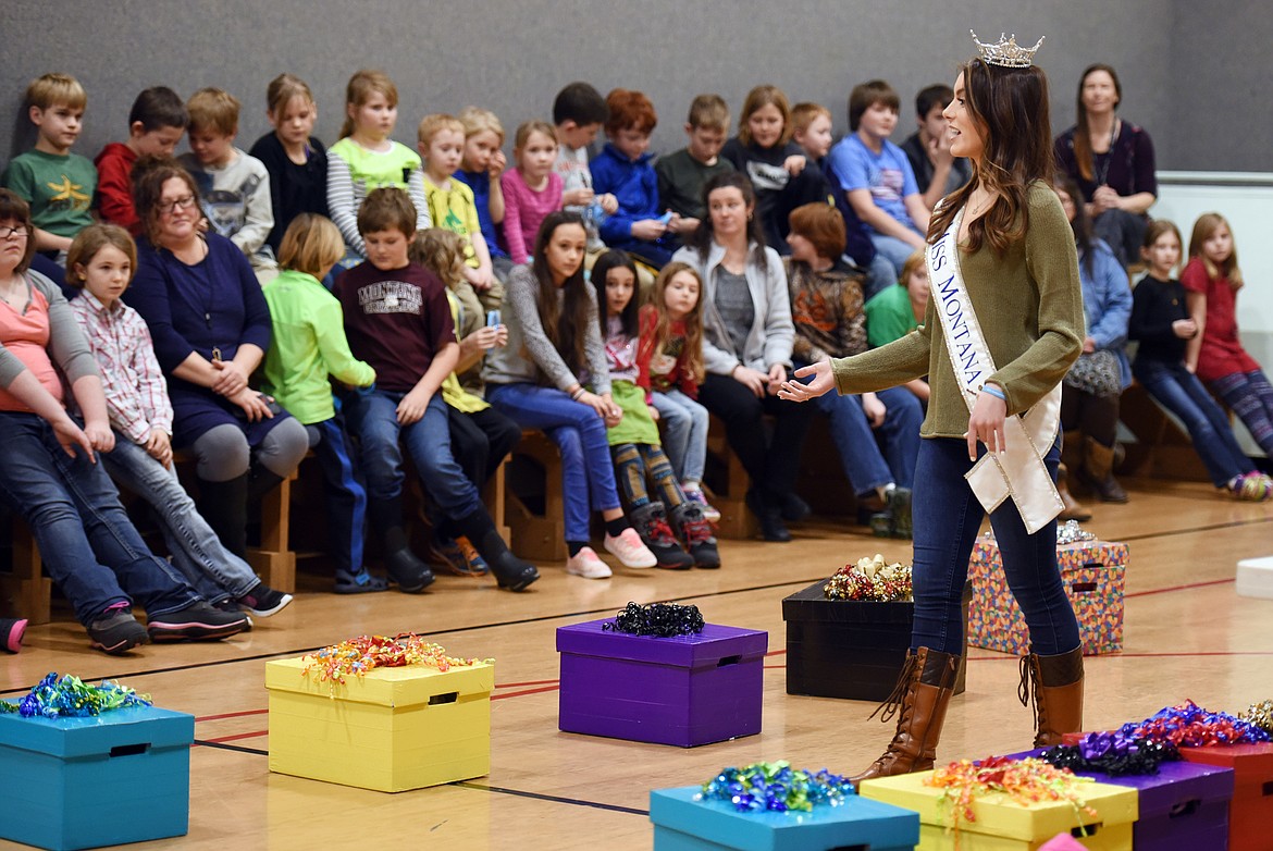 Miss Montana Maddie Murray talks with kindergarten through sixth-grade students at West Glacier Elementary on Tuesday, Jan. 30. Murray brought an interactive presentation on Gift Your Gift of Service to schools around the valley. Her message to students is that they can improve the lives of others and their own by sharing their gifts and talents to help people out. (Brenda Ahearn/Daily Inter Lake)