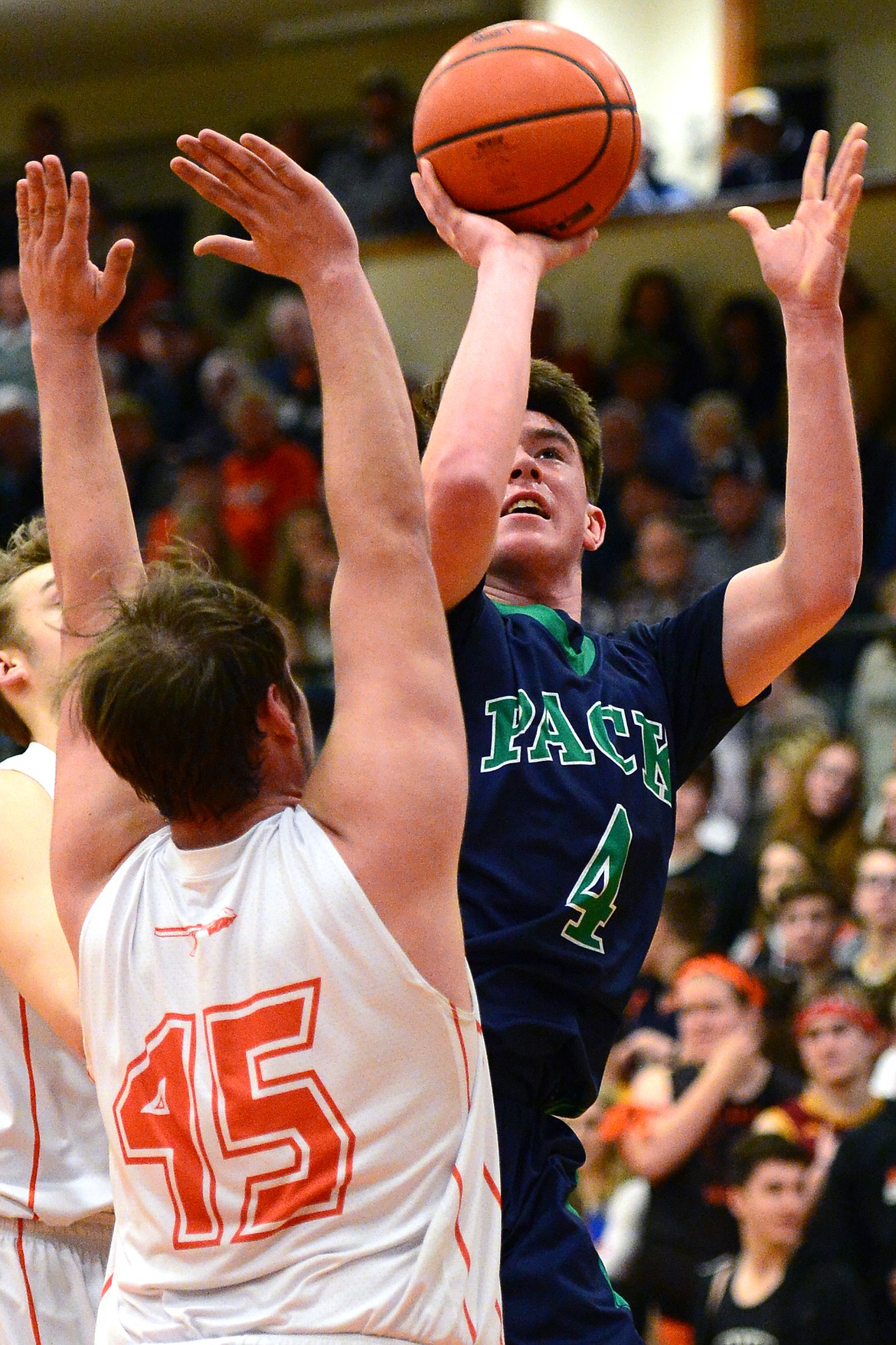 Glacier&#146;s Collin Kazmier shoots over Flathead&#146;s Dawson Smith. (Casey Kreider/Daily Inter Lake)