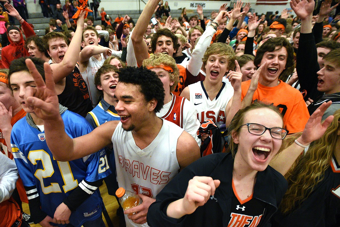 Flathead&#146;s Anthony Jones celebrates with fans on the court after a 59-55 overtime crosstown victory over Glacier at Flathead High School on Thursday. (Casey Kreider/Daily Inter Lake)