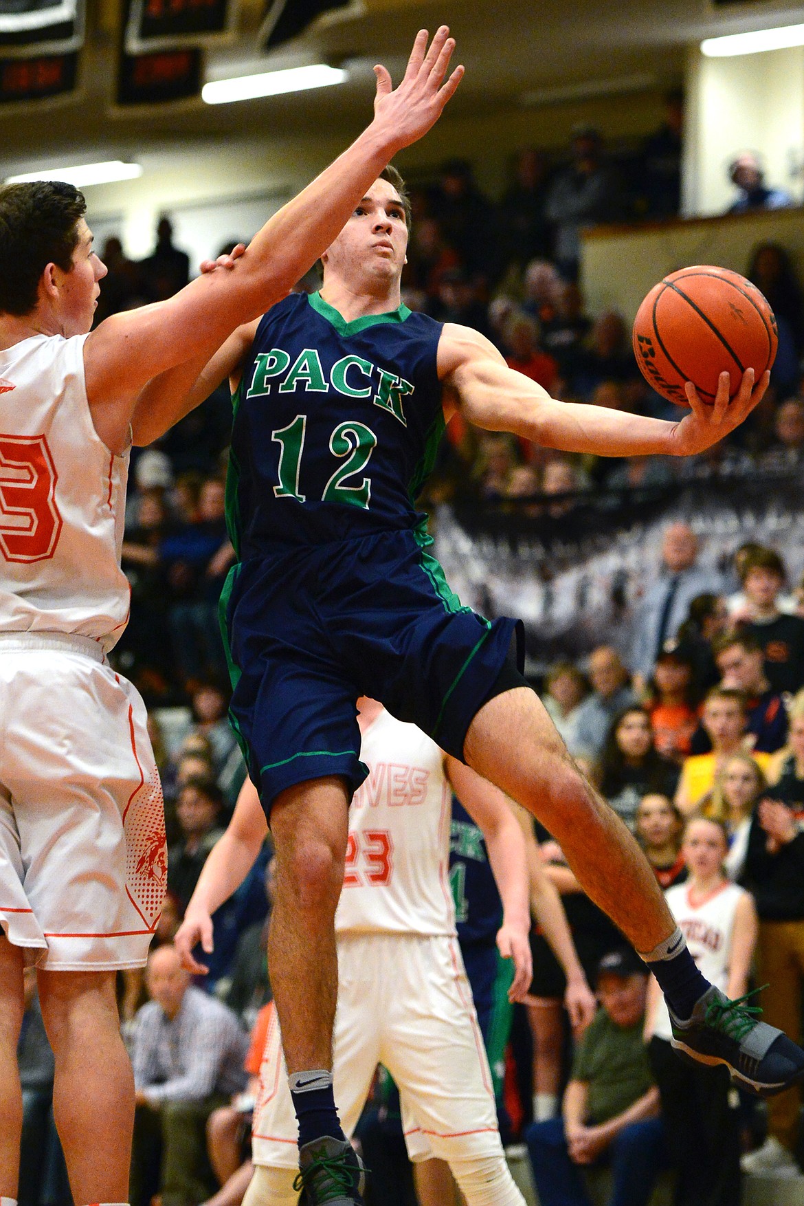 Glacier&#146;s Kody Jarvis drives to the hoop past Flathead&#146;s Sam Elliott. (Casey Kreider/Daily Inter Lake)