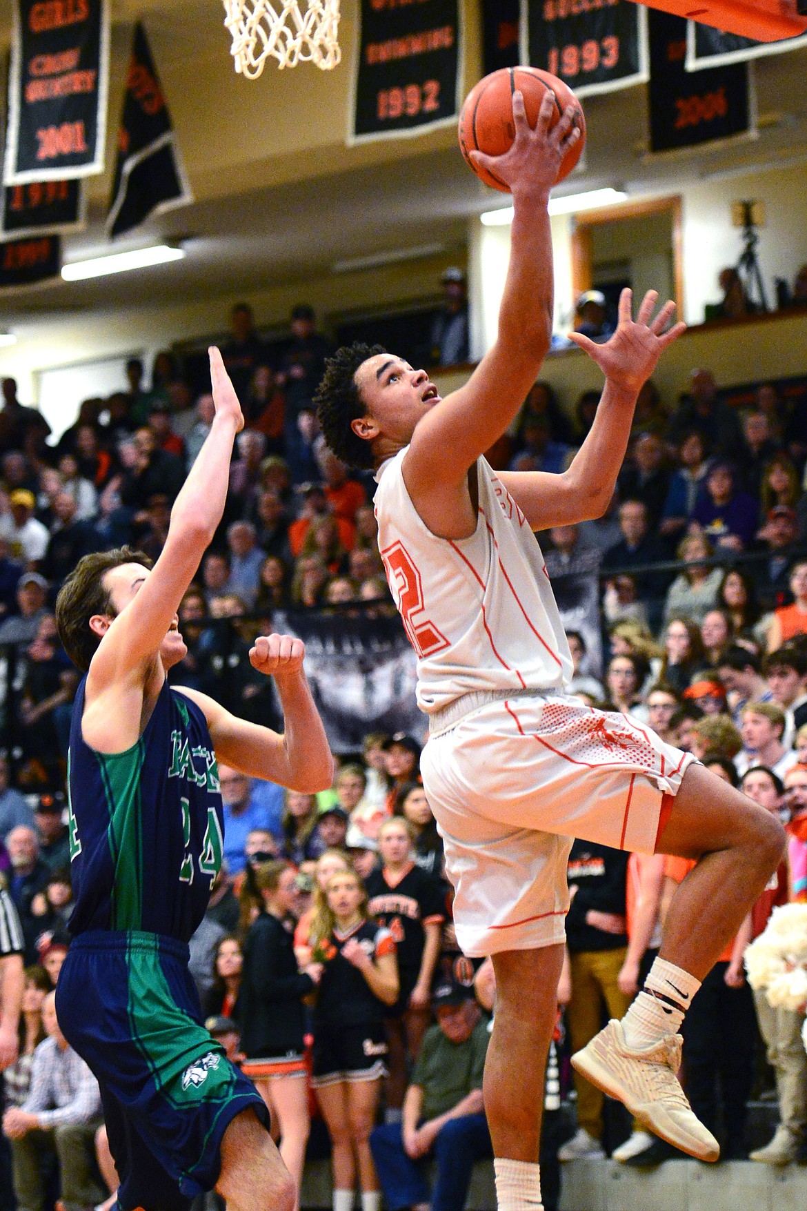 Flathead&#146;s Anthony Jones cruises to the hoop ahead of Glacier&#146;s Alex Whitman. (Casey Kreider/Daily Inter Lake)