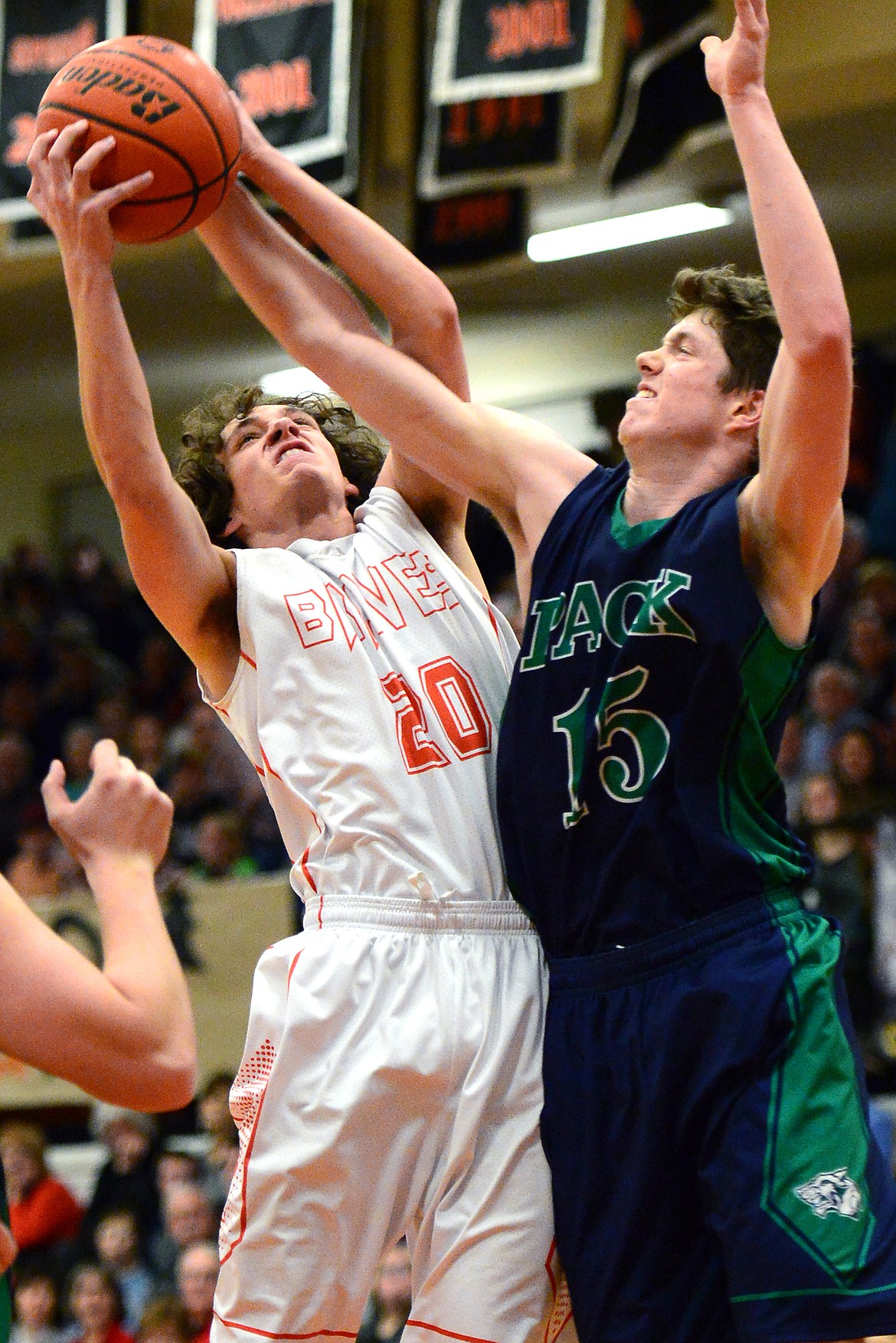 Flathead&#146;s Clayton Jacques and Glacier&#146;s Drew Engellant battle for a rebound. (Casey Kreider/Daily Inter Lake)