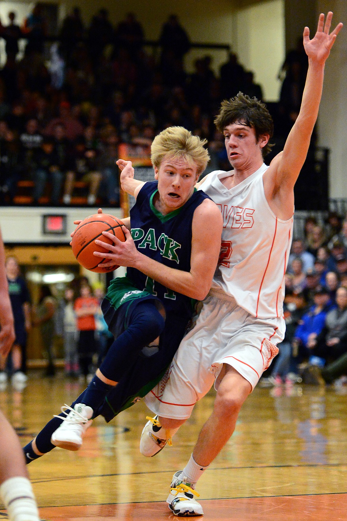 Glacier&#146;s Brec Rademacher drives to the hoop against Flathead&#146;s Tyler Johnson. (Casey Kreider/Daily Inter Lake)