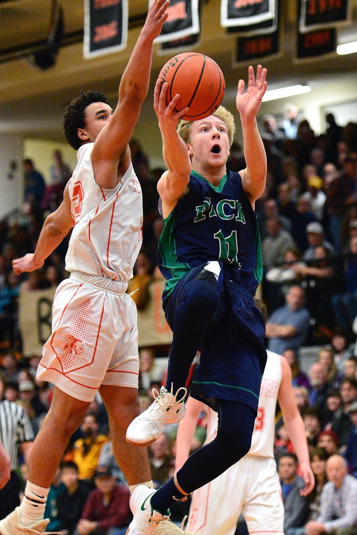 Glacier&#146;s Brec Rademacher drives to the hoop past Flathead&#146;s 
Anthony Jones. (Casey Kreider/Daily Inter Lake)