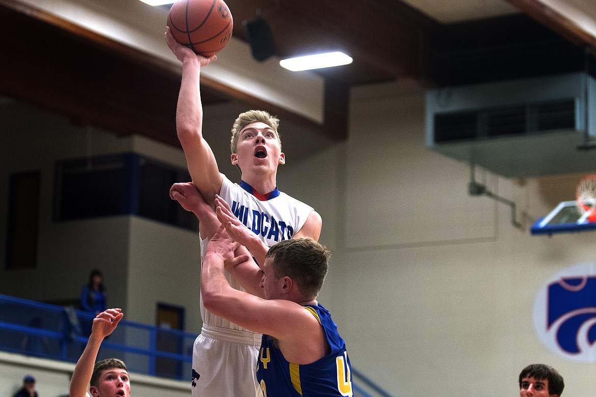 Matthew Morrison goes up for a jumper against the Loggers Thursday. Morrison, who battled foul trouble throughout the contest, finished with five points and five rebounds. (Jeremy Weber photo)