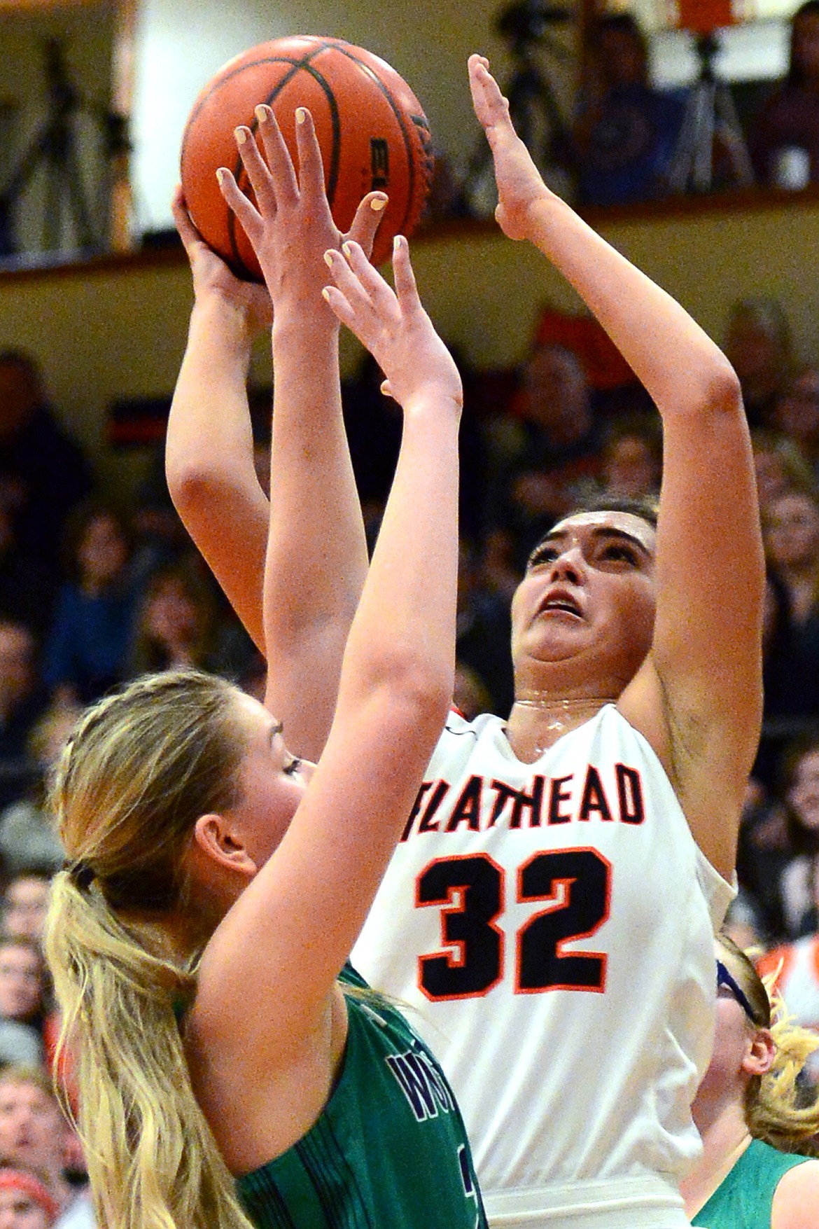 Flathead&#146;s Taylor Henley drives to the basket with Glacier&#146;s Kaileigh Crawford defending. (Casey Kreider/Daily Inter Lake)