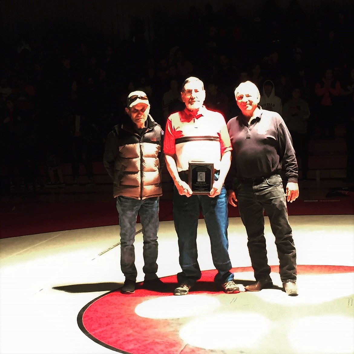 Courtesy photo - Mike Williams (center), along side Wayne Schutte (left) and Ruben Martinez (right), was recognized for his contribution to the Othello High School wrestling program.