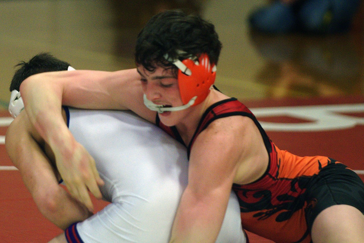 Daniel Uli wrestles at the Western B/C Divisional tournament. (Jason Blasco/ Lake County Leader)