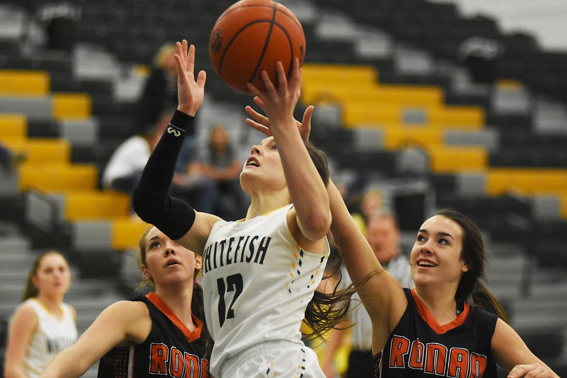 Kyiah Moore drives in for a layup against Ronan last Tuesday at home. (Daniel McKay/Whitefish Pilot)