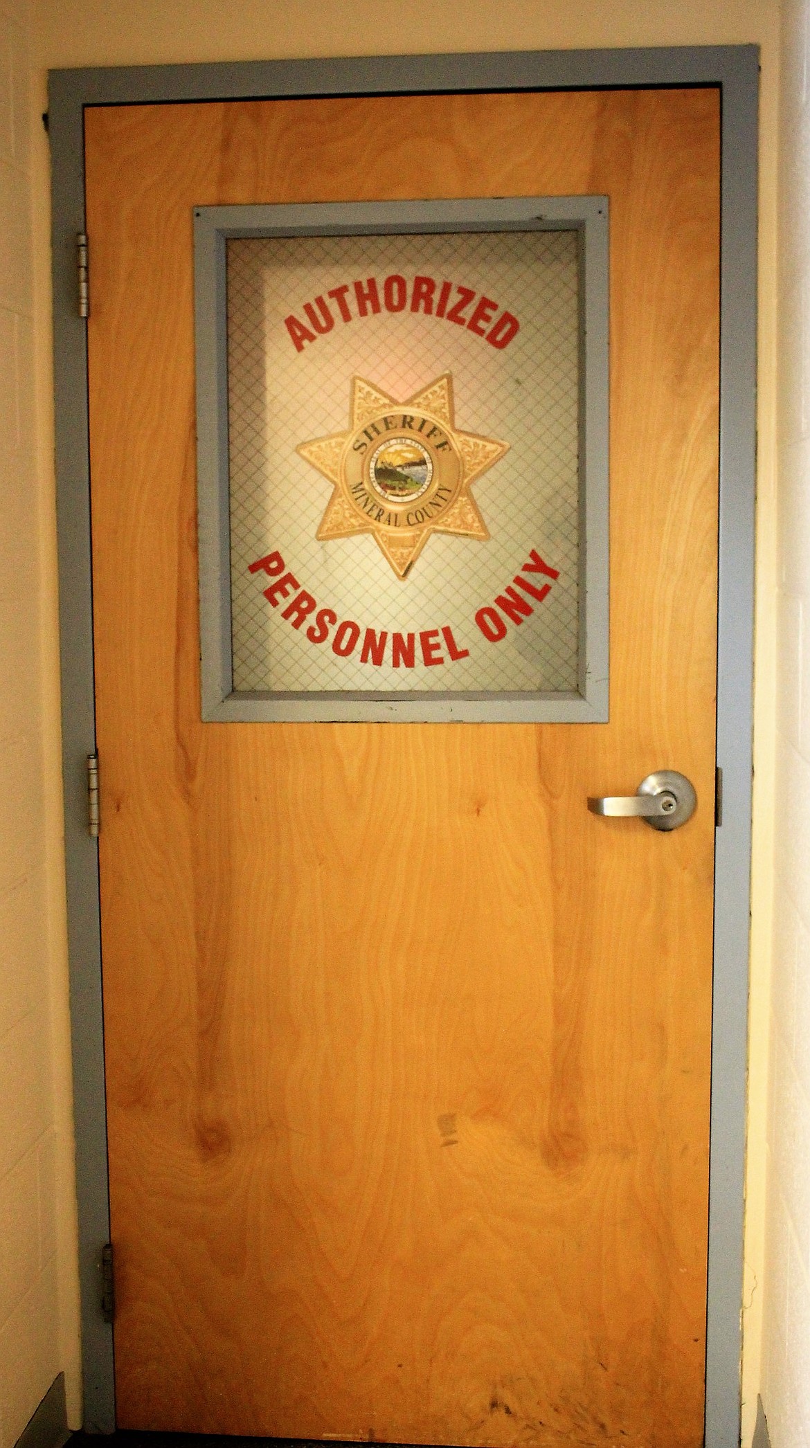 Through this door is the Mineral County Detention Center and Dispatch. Several community members were able to get a tour of the freshy painted and refurbished jail cells. The facility is tentatively scheduled to reopen by mid-February. (Kathleen Woodford/Mineral Independent)