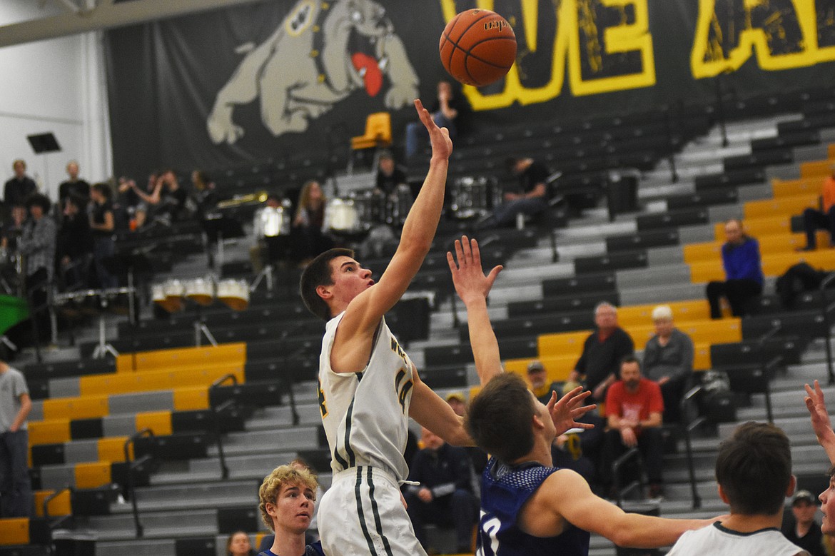 Lee Walburn floats a layup against Corvallis on Friday at Whitefish High School. (Daniel McKay/Whitefish Pilot)